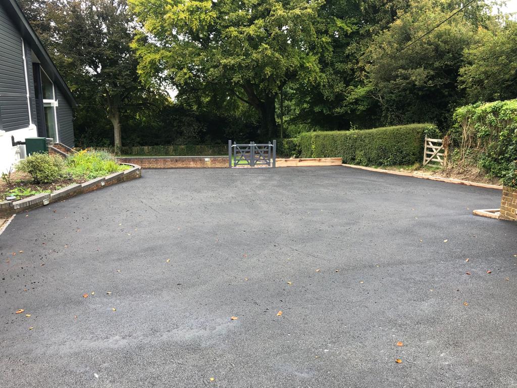 This is a photo of a bitumen driveway which is in the process of being installed by Maleny Asphalt & Bitumen Surfacing